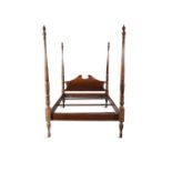 A GEORGE IV STYLE FOUR POSTER BED each fluted post carved with ribbon tied sheaths of wheat and