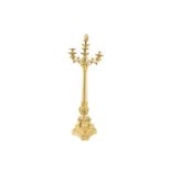 A REGENCY GILT METAL CANDLEABRUM with four sconces supported on a turned and leaf cast column,