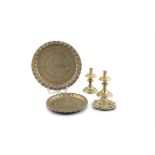 A COLLECTION COMPRISING; pair of 19th century brass candlesticks and two brass circular trays