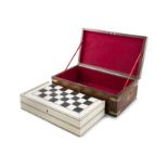 A VICTORIAN MAHOGANY GAMES BOX containing an inlaid ivory and satinwood folding chess board,