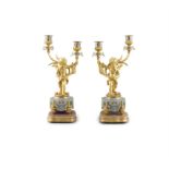 A PAIR OF LATE 19TH CENTURY FRENCH ORMOLU FIGURAL CANDELABRA each putto supporting a branch