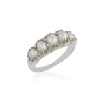 A PEARL RING, claw-set with five graduated pearls of whit tint, to a tapered mount,