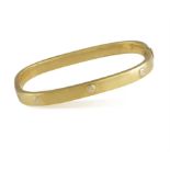 A BANGLE, of hinged design, the square bangle highlighted by screw details, mounted in 18K gold,