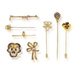 A GROUP OF NINE TIE PINS OR BROOCHES, two brooches, four tie pins and two bar brooches,