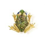 AN ENAMEL AND SAPPHIRE NOVELTY BROOCH, 1988, modelled as a frog, the body decorated with green