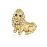 A SAPPHIRE AND DIAMOND PENDANT, modelled as a dog, its eyes set with circular-cut sapphires, ears,