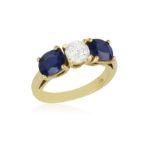 A SAPPHIRE AND DIAMOND RING, composed of a brilliant-cut diamond, between two oval sapphires,