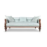 A VICTORIAN MAHOGANY FRAMED THREE SEAT SETTEE, the stuffed tub back and seat covered in a