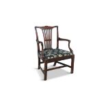 A GEORGE III MAHOGANY FRAMED ELBOW CHAIR, the shaped crest rail above a pierced splat,