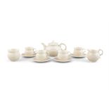 A BELLLEEK FIRST PERIOD TEA SERVICE comprising a teapot, milk jug, sugar bowl,