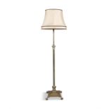 A BRASS CORINTHIAN COLUMN STANDARD LAMP with raised light socket on stepped plinth base,