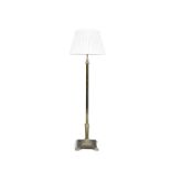 A BRASS STANDARD LAMP with central column raised on stepped plinth base and paw feet