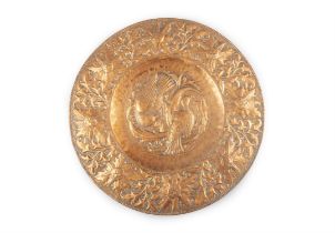 AN ARTS & CRAFTS CIRCULAR COPPER CHARGER BY JOHN S. PEARSON (1859-1930), with repousse,