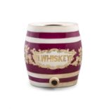 A PORCELAIN IRISH WHISKEY BARREL, the oval body painted with red stripes and 'I.