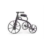 AN EDWARDIAN MODEL OF A TRICYCLE with articulated pedals, wheels and handlebars,