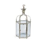 A BRASS FRAMED HEXAGONAL HALL LANTERN, with applied anthemion decoration above clear glass