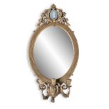 A VICTORIAN GILTWOOD GIRANDOLE MIRROR c.1840, with plain oval glass plate, surmounted by a