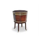 A GEORGE IV BRASS BOUND MAHOGANY OCTAGONAL CELLARETTE, fitted hinged top and twin side