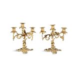 A PAIR OF FRENCH GILT BRONZE THREE BRANCH FIGURAL CANDELABRA, 19TH CENTURY the leaf cast