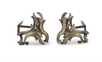 A LOUIS QUINZE STYLE PAIR OF GILT BRASS CHENETS, of cast scroll form