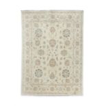 AN IVORY GROUND 'ZEIGLER' PATTERN CARPET of rectangular shape, the centre field with scattered