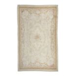 A LARGE AUBUSSON TAPESTRY CARPET. 374 x 242CM the cream ground field woven with central floral