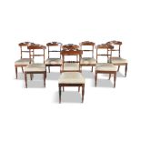 A SET OF EIGHT WILLIAM IV ROSEWOOD DINING CHAIRS, each with curved tablet back and leaf carved