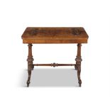 A VICTORIAN WALNUT CENTRE TABLE on turned side supports and splayed feet with casters,