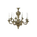 A LATE VICTORIAN ORMOLU EIGHT BRANCH CHANDELIER cast with bold 'S' scroll arms and with river