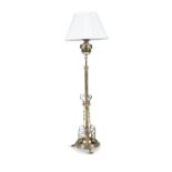 A VICTORIAN BRASS AND COPPER MOUNTED ADJUSTABLE STANDARD LAMP, fitted with an oil lamp,