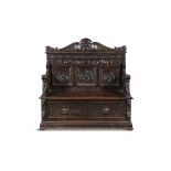 A 19TH CENTURY CARVED OAK MONKS BENCH the rectangular back with three figural panels above a