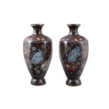 A PAIR OF 20TH CENTURY CLOISONNÉ VASES, each of baluster form, decorated polychrome flowers,