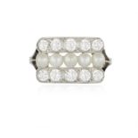 A BELLE EPOQUE PEARL AND DIAMOND DRESS RING The central row set with five seed pearls between