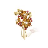 A GEM-SET FLOWER BROOCH, CIRCA 1955 Designed as a stylised flower bouquet, set with fancy-cut