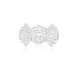 AN EARLY 20TH CENTURY DIAMOND BROOCH Designed as a stylised bow, the pierced plaque centring a