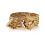 A MID-20TH CENTURY GOLD AND DIAMOND JARRETIÈRE BRACELET, FRENCH, CIRCA 1960 Designed as a woven