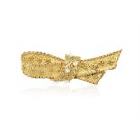 A DIAMOND BROOCH, BY GEORGES LENFANT, CIRCA 1970 Designed as a stylised ribbon in textured and
