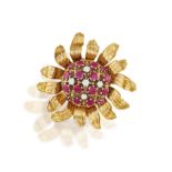 A RUBY AND DIAMOND BROOCH Modelled as a stylised sunflower flowerhead, the pistils set with