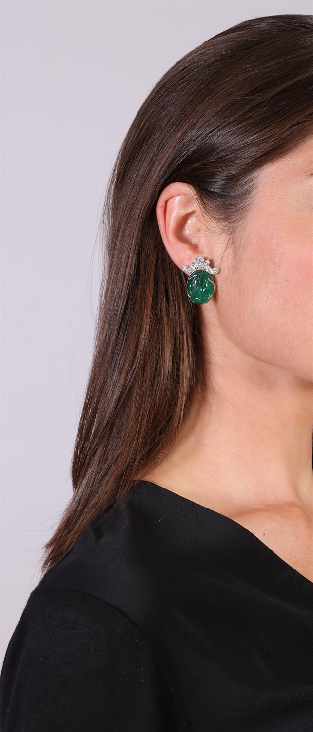 A PAIR OF EMERALD AND DIAMOND EARCLIPS Each oval-shaped carved emerald with foliate detailing - Image 2 of 3