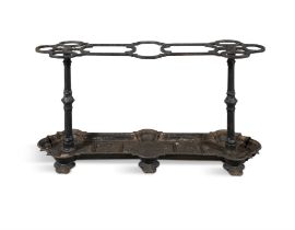 A VICTORIAN BLACK PAINTED CAST IRON STICK STAND, 19th century the nine-compartment top with three