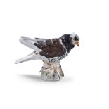 A 19TH CENTURY MEISSEN PAINTED PORCELAIN MODEL OF A PIGEON, with feathered feet, on rocky base, with
