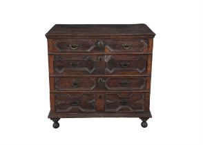 AN OAK CHEST OF DRAWERS, LATE 17TH CENTURY of rectangular form, the top with moulded rim, above four