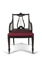 A LATE VICTORIAN MAHOGANY FRAMED ELBOW CHAIR, of George III Style, with brass-mounted lyre splat