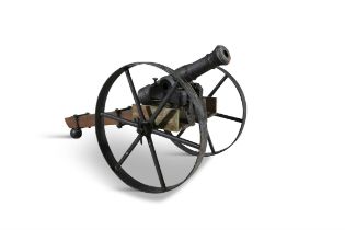 A 19TH CENTURY CAST IRON CANNON, on a later wheeled carriage 77cm high, 84cm wide, 167cm long