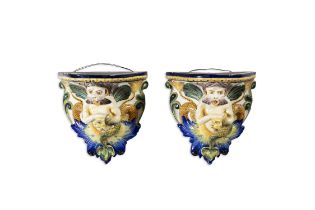 A PAIR OF ITALIAN CANTAGALLI MAJOLICA WALL BRACKETS, C. 1900, modelled with grotesque marine figures