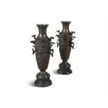 A PAIR OF JAPANESE BRONZE IKEBANA VASES, LATE 19TH CENTURY, each of cylindrical shape, decorated
