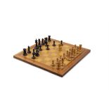 A STAUNTON PATTERN CHESS SET AND CHESS BOARD BY J.JAQUES LONDON, The chessmen with one boxwood and