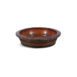 A STAINED WOOD AND METAL BOUND SHALLOW BASIN. 74cm diameter, 17.5cm high