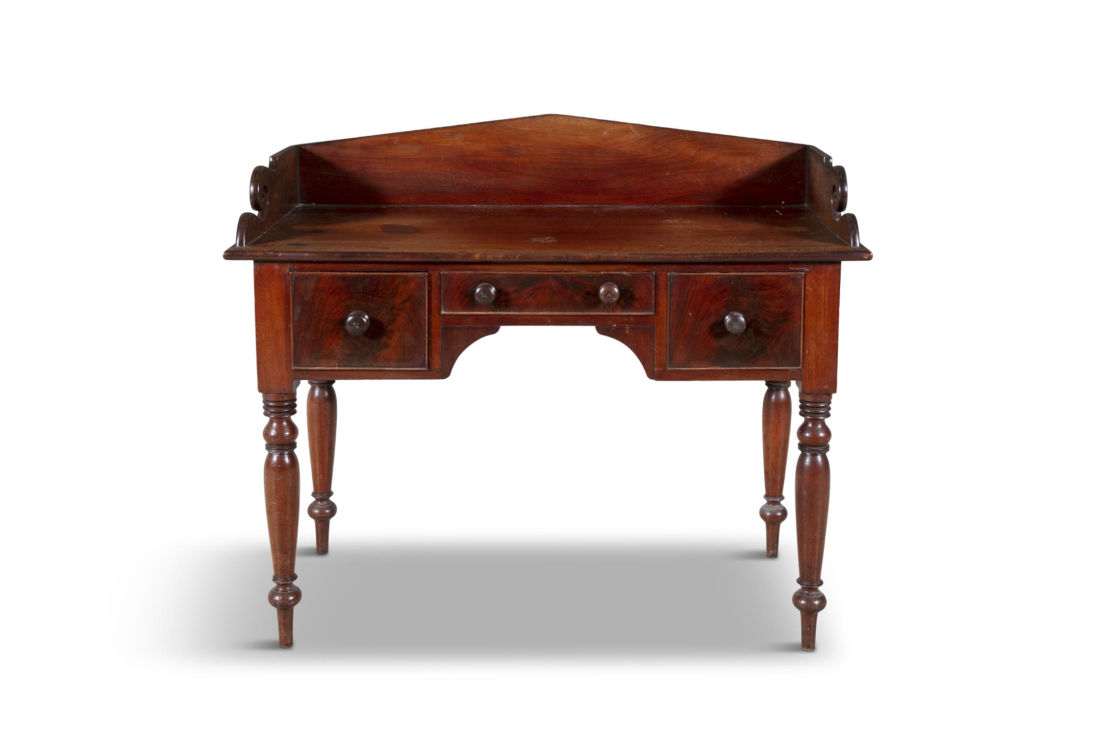 A VICTORIAN MAHOGANY DRESSING TABLE, C.1840 the rectangular top with raised three quarter gallery