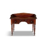 A VICTORIAN MAHOGANY DRESSING TABLE, C.1840 the rectangular top with raised three quarter gallery